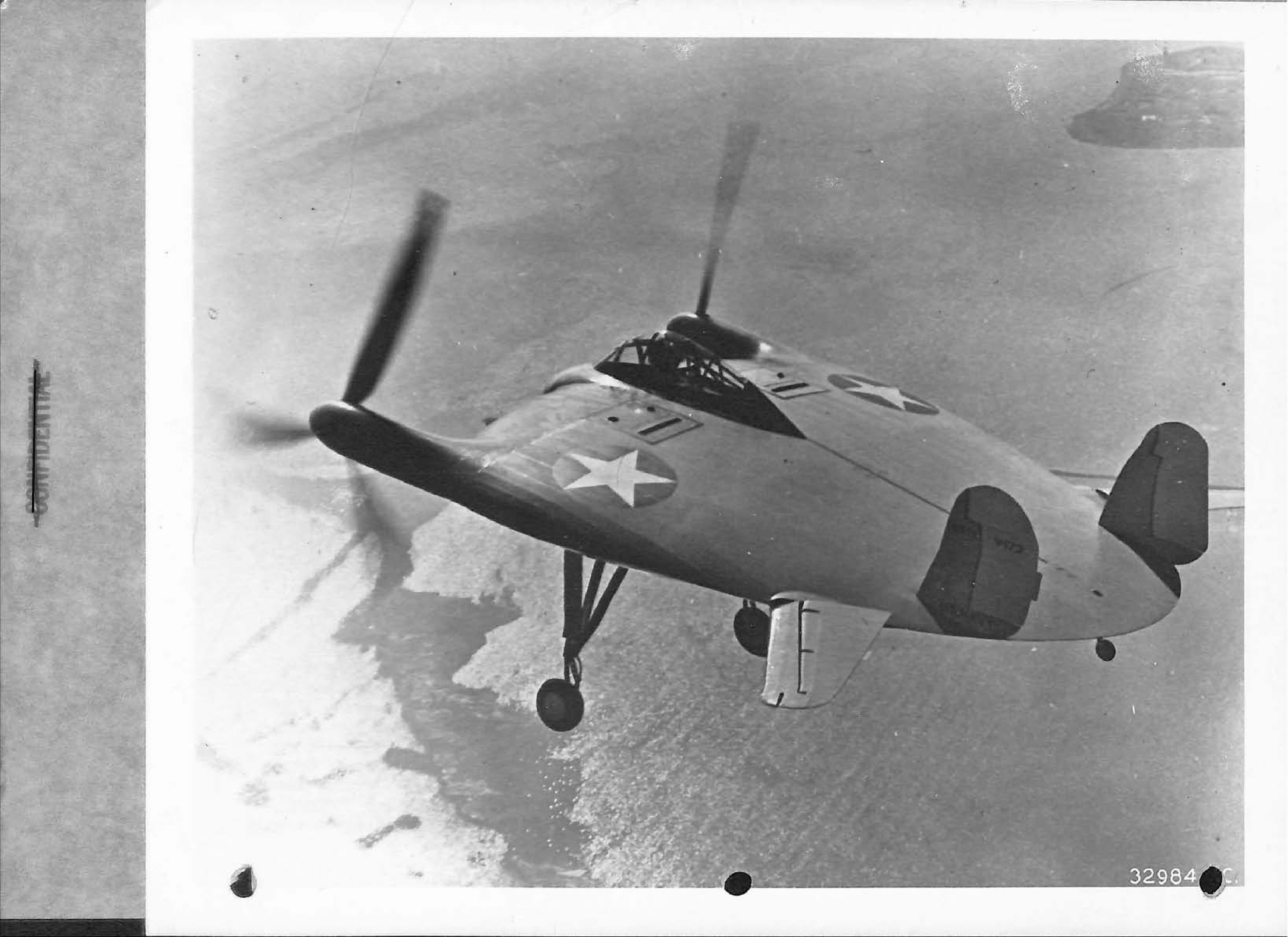 Photograph of the Chance-Vought XF5U-1 experimental aircraft in flight over water.