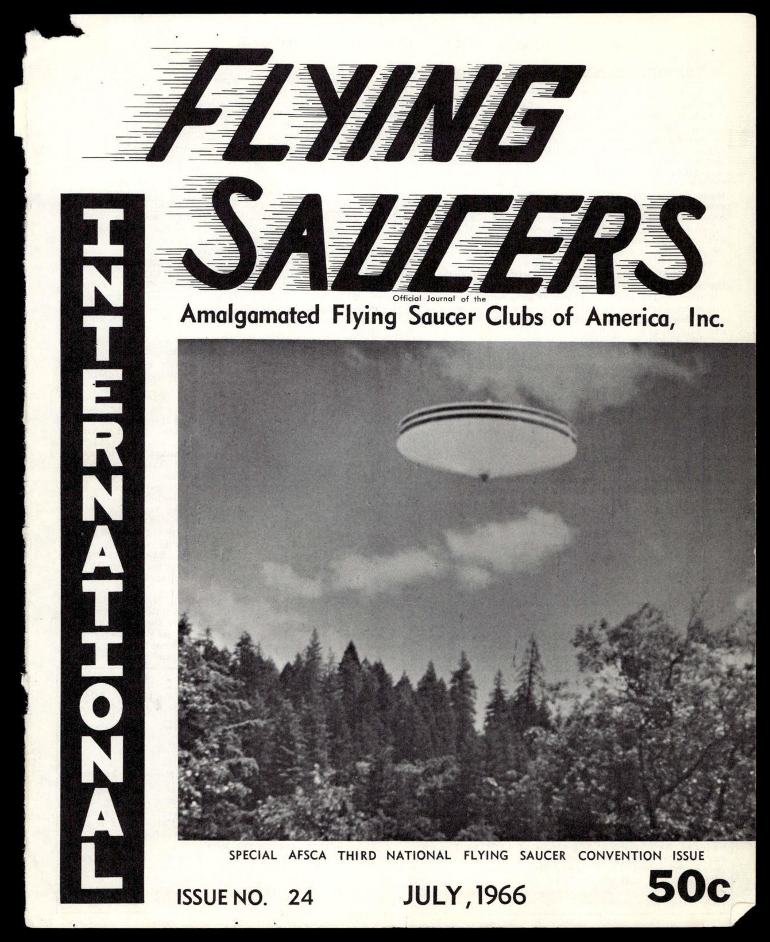 Flying saucer photograph over forested landscape with clouds